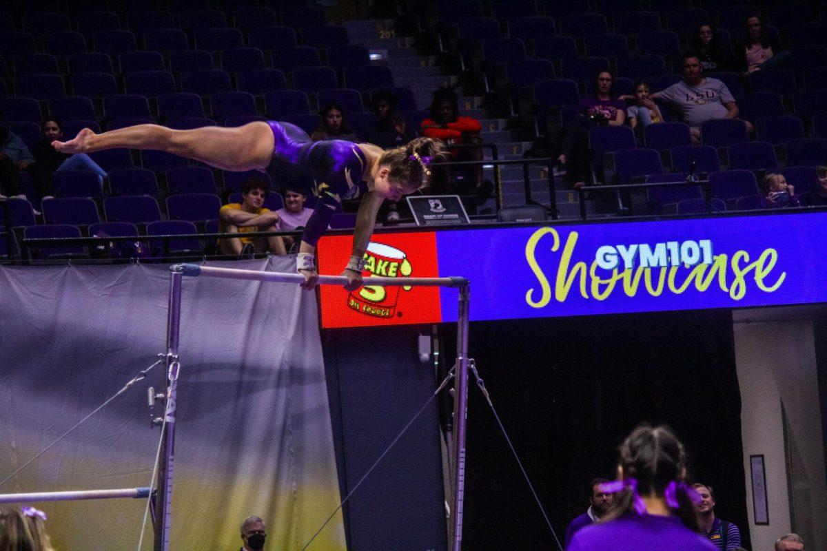 LSU gymnastics freshman all-around Ashley Cowan does a split on the uneven bars Monday, Dec. 12, 2022, during the annual "Gym 101" showcase in the Pete Maravich Assembly Center.