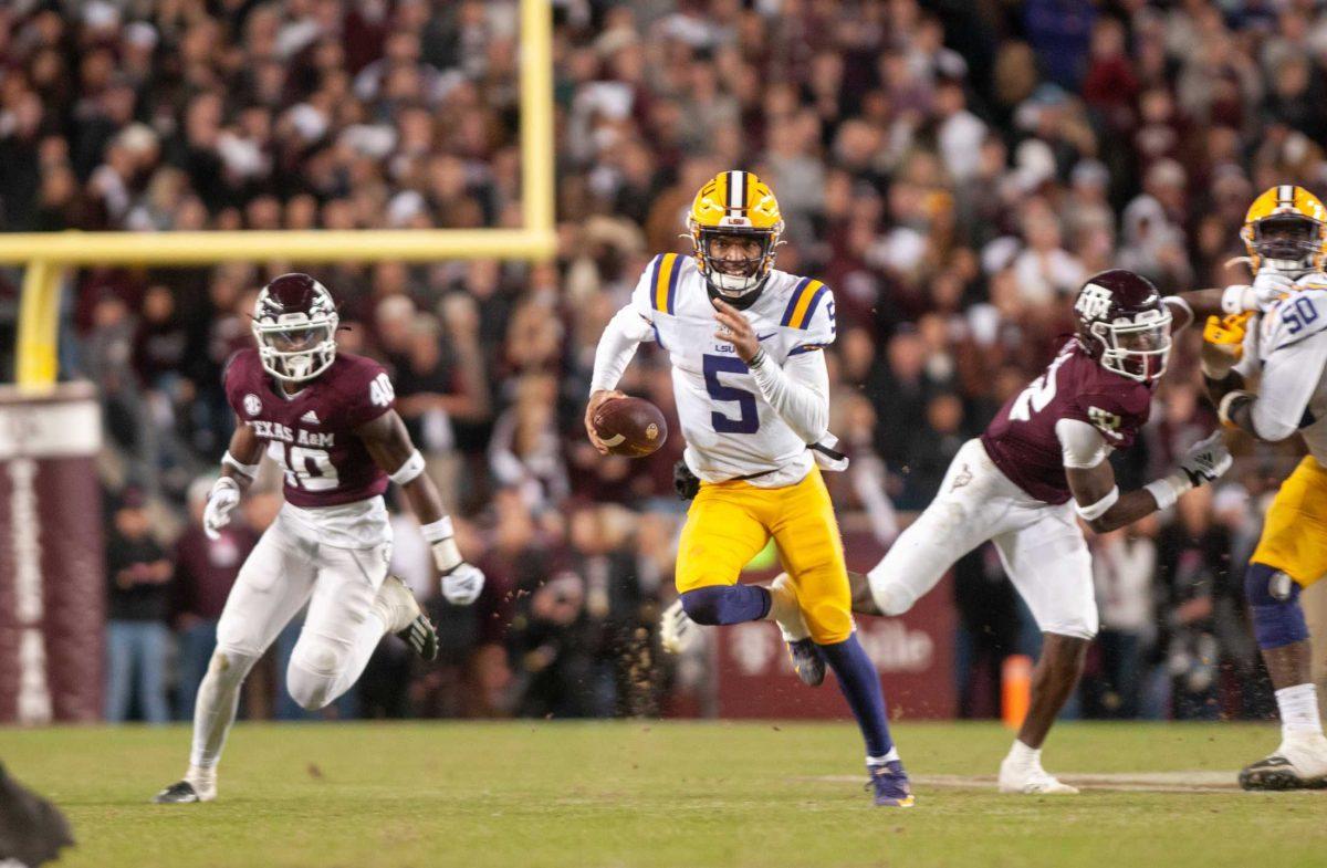 LSU football junior quarterback Jayden Daniels (5) darts down the field on Saturday, Nov. 26, 2022, during LSU's 23-38 loss against Texas A&amp;M at Kyle Field.