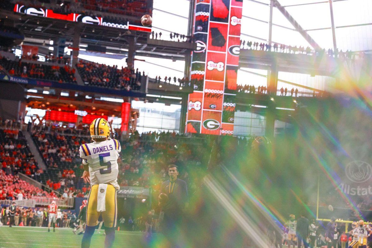 LSU football junior quarterback Jayden Daniels (5) warms up Saturday, Dec. 3, 2022, prior to LSU's 30-50 loss to Georgia at the Mercedes-Benz Stadium in Atlanta, Georgia.