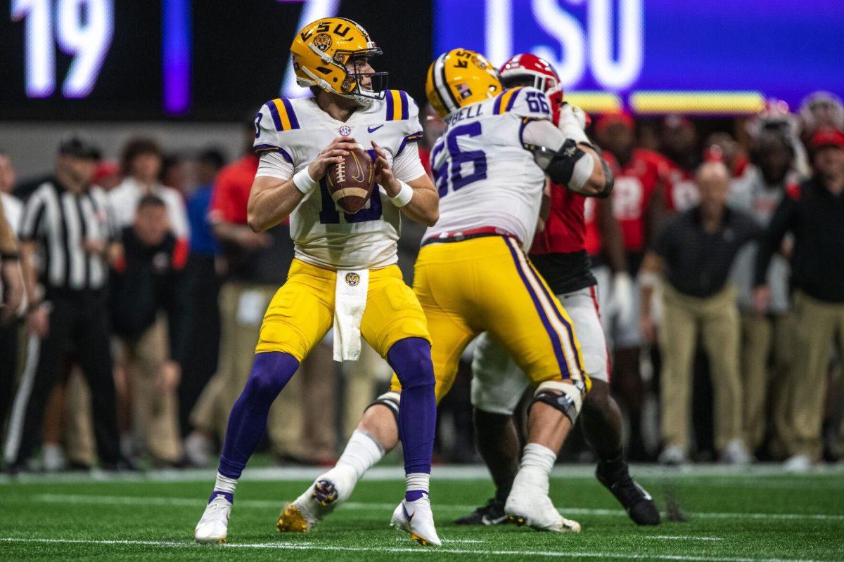 LSU football red-shirt freshman quarterback Garrett Nussmeier (13) looks to make a pass Saturday, Dec. 3, 2022, during LSU's 30-50 defeat to Georgia at the Southeastern Conference Championship at the Mercedes-Benz Stadium in Atlanta, Georgia.