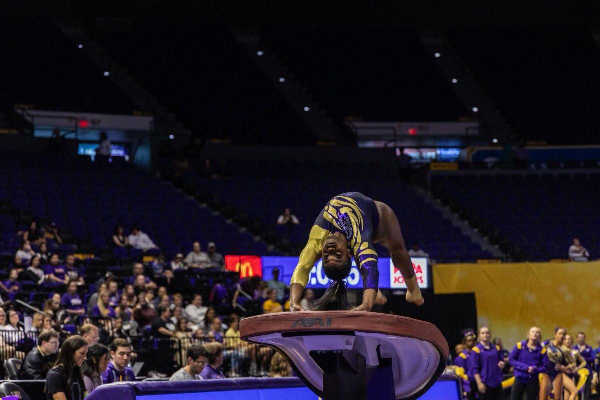 LSU gymnastics senior all-around Kiya Johnson jumps on the vault Monday, Dec. 12, 2022, during the annual "Gym 101" showcase in the Pete Maravich Assembly Center.