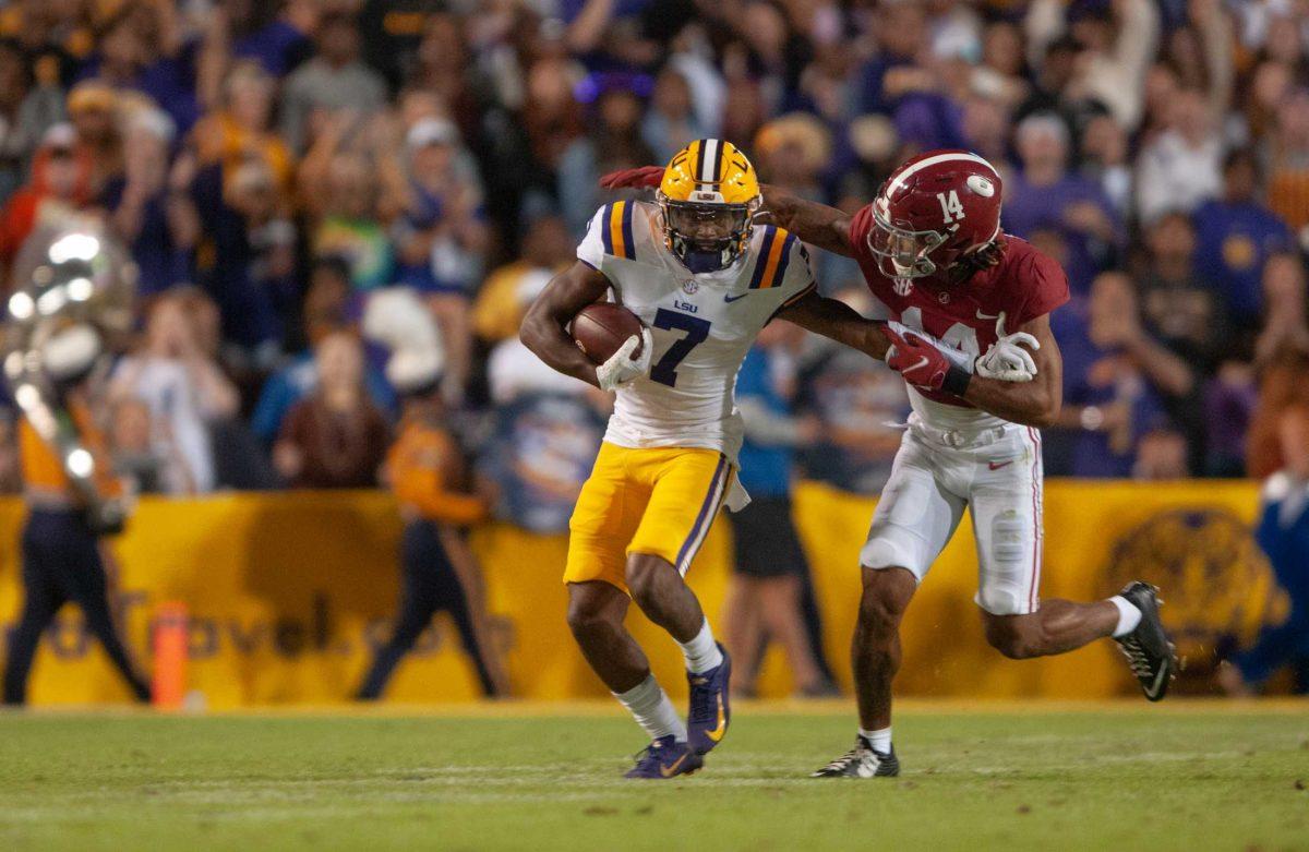 LSU football junior wide receiver Kayshon Boutte (7) pushes his opponent away on Saturday, Nov. 5, 2022, during LSU's 32-31 victory in Tiger Stadium in Baton Rouge, La.