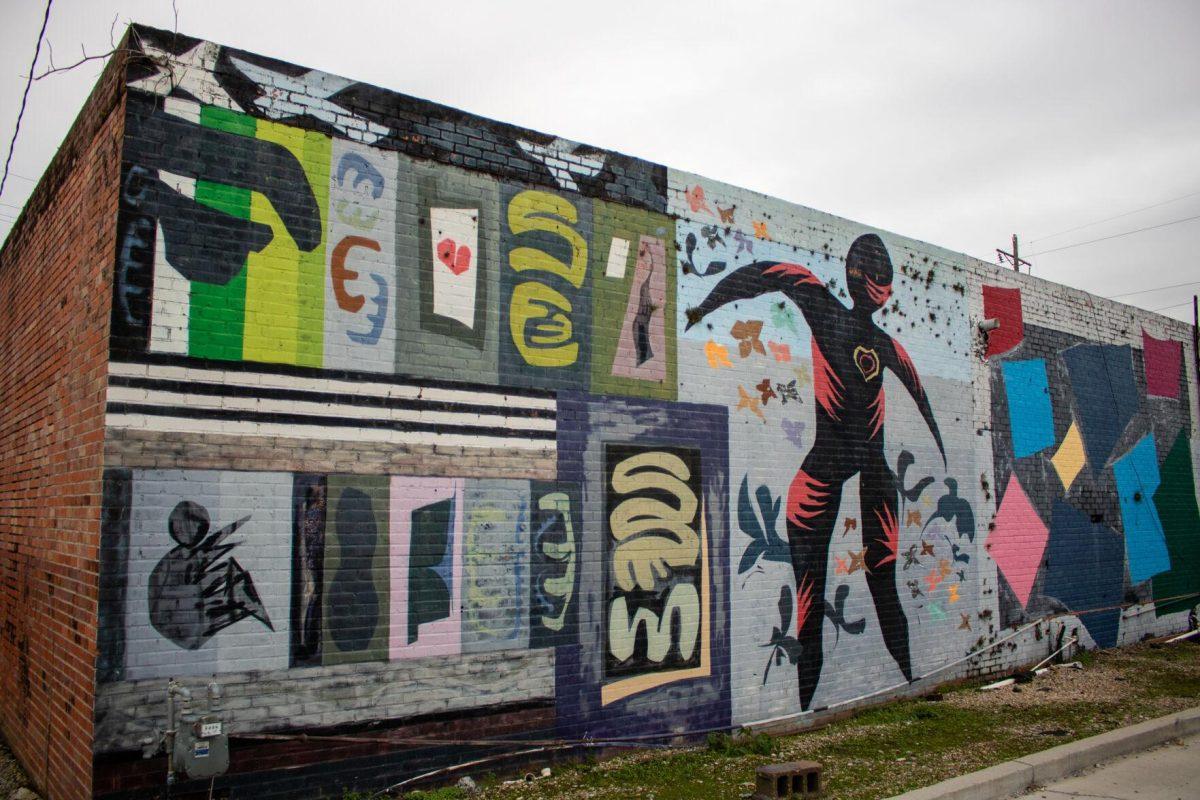 A painted mural lines a building on Friday, Dec 2, 2022, on Government St. in downtown Baton Rouge, La.