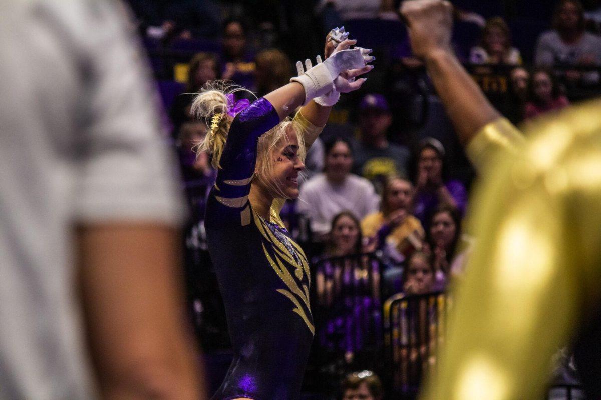 LSU gymnastics junior all-around Olivia Dunne celebrates after a successful uneven bars routine Monday, Dec. 12, 2022, during the annual "Gym 101" showcase in the Pete Maravich Assembly Center.
