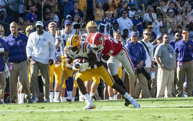 LSU football player catches the ball during LSU's 36-16 win against Georgia on Saturday, Oct. 13, 2018, at Tiger Stadium