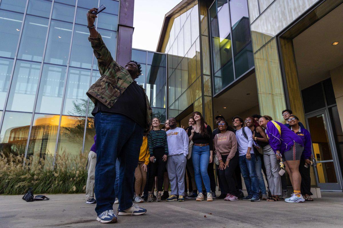 US Senate candidate Gary Chambers takes a selfie with LSU students Wednesday, Oct. 26, 2022, at the Business Education Complex on LSU's campus.