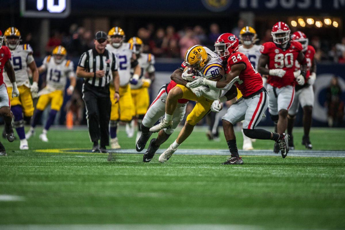 LSU football freshman tight end Mason Taylor (86) pushes through Georgia defenders Saturday, Dec. 3, 2022, during LSU's 30-50 defeat to Georgia at the Southeastern Conference Championship in the Mercedes-Benz Stadium in Atlanta, Georgia.