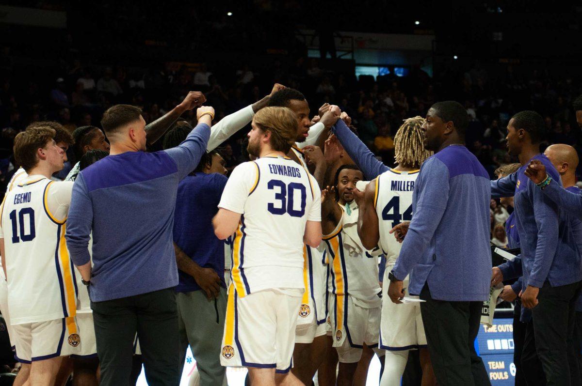 The LSU men&#8217;s basketball team puts their hands together after a timeout during LSU&#8217;s 63-59 win against UT Arlington on Friday, Dec. 2, 2022, in the Pete Maravich Assembly Center on N. Stadium Drive in Baton Rouge, La.