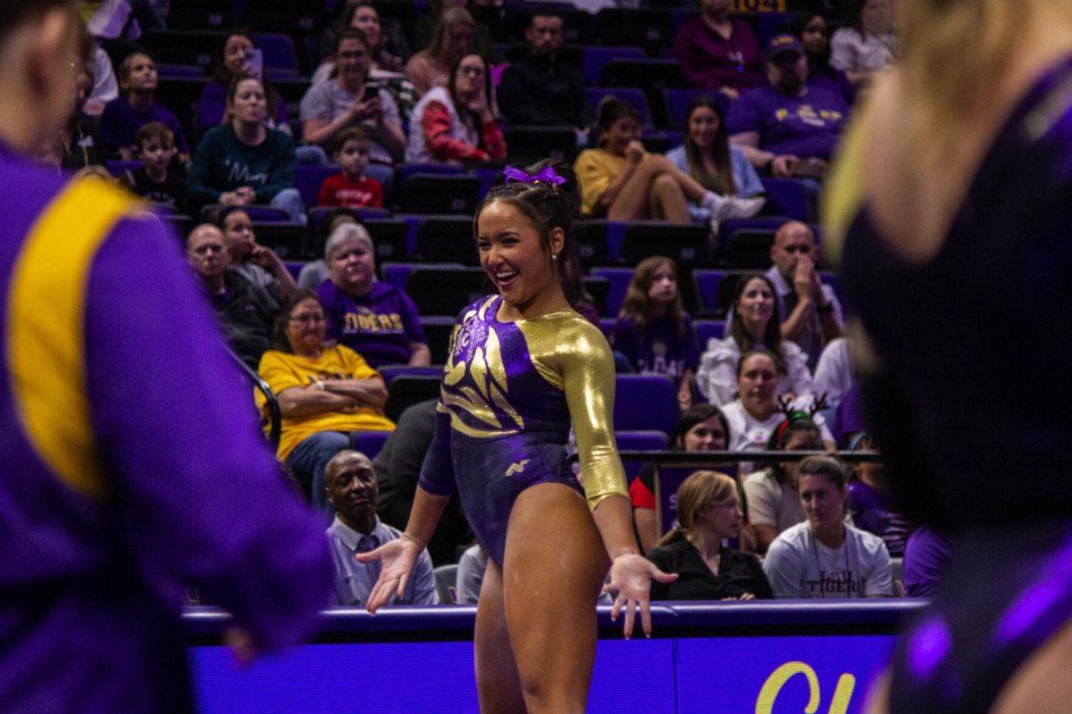 LSU gymnastics sophomore all-around Aleah Finnegan smiles at her teammates during her floor routine Monday, Dec. 12, 2022, at the annual "Gym 101" showcase in the Pete Maravich Assembly Center.