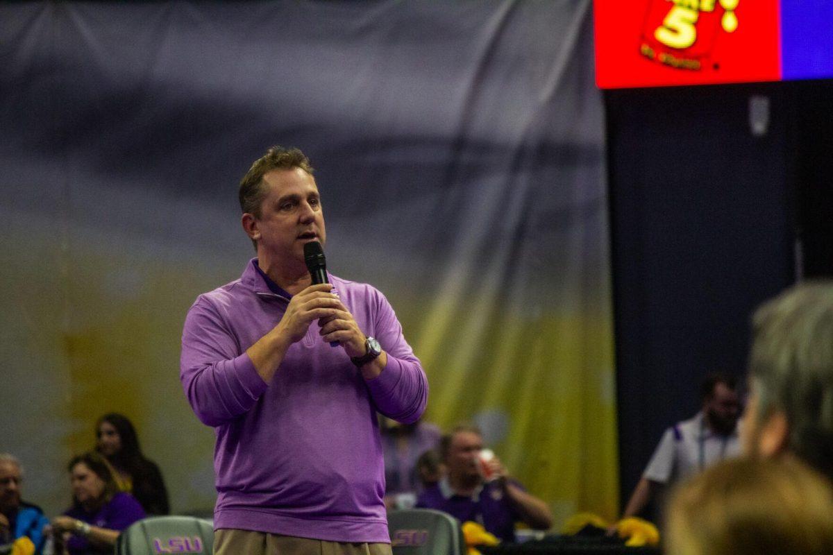 LSU gymnastics head coach speaks to the crowd Monday, Dec. 12, 2022, during the annual "Gym 101" showcase talking about the season ahead in the Pete Maravich Assembly Center.