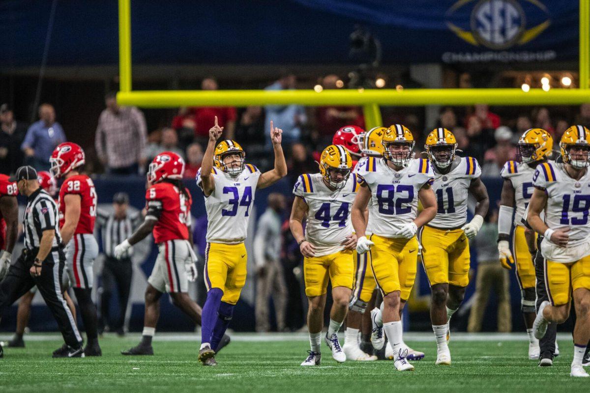 LSU football red-shirt freshman Damian Ramos (34) points to the sky after scoring a field goal Saturday, Dec. 3, 2022, during LSU's 30-50 defeat to Georgia at the Southeastern Conference Championship at the Mercedes-Benz Stadium in Atlanta, Georgia.