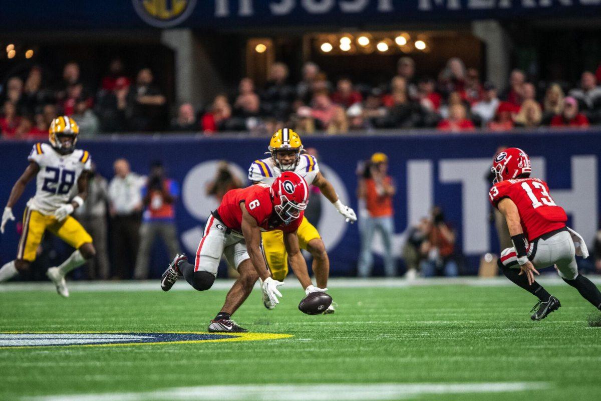 Georgia football senior running back Kenny McIntosh (6) runs after a fumble Saturday, Dec. 3, 2022, during LSU's 30-50 defeat to Georgia at the Southeastern Conference Championship at the Mercedes-Benz Stadium in Atlanta, Georgia.
