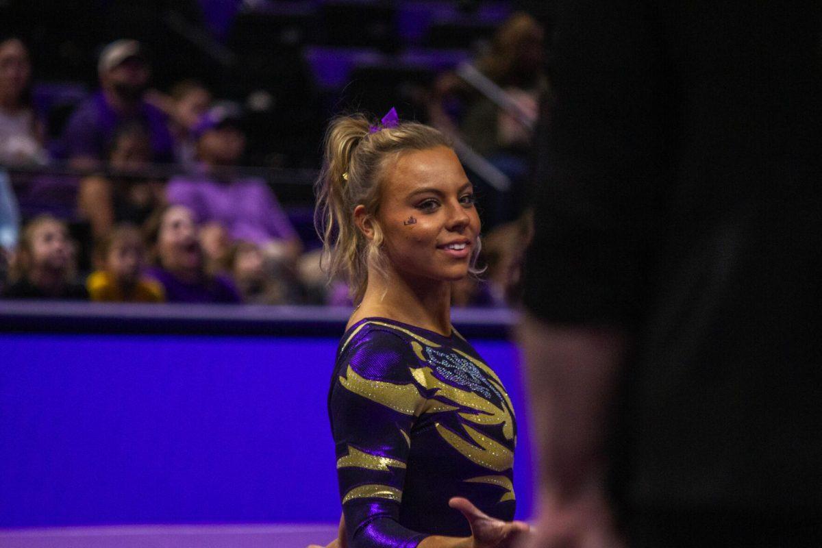 LSU gymnastics junior vault/ uneven bars Chase Brock strikes a pose during her floor routine Monday, Dec. 12, 2022, during the annual "Gym 101" showcase in the Pete Maravich Assembly Center.