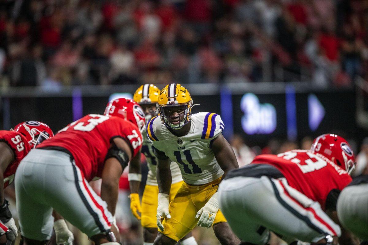 LSU football fifth-year senior defensive end Ali Gaye (11) eyes down the Georgia offense Saturday, Dec. 3, 2022, during LSU's 30-50 defeat to Georgia at the Southeastern Conference Championship at the Mercedes-Benz Stadium in Atlanta, Georgia.