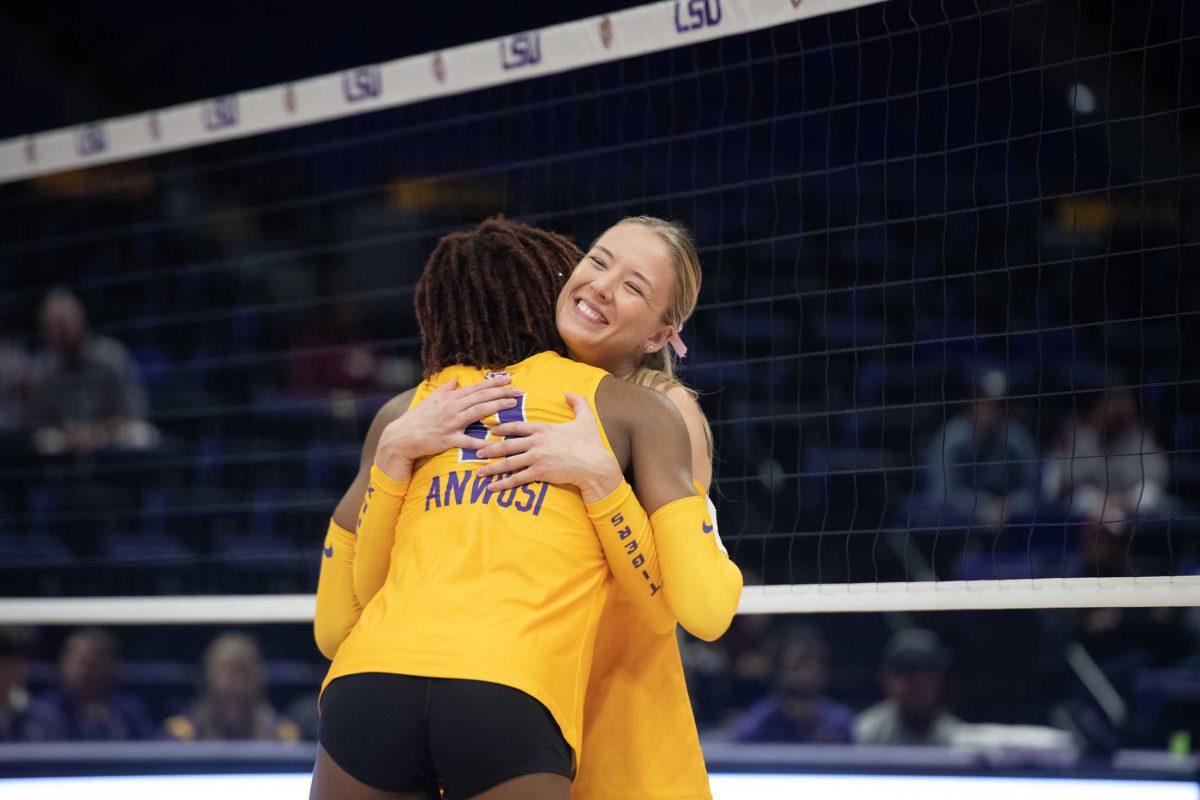 LSU volleyball graduate student Josie Vondran (5) hugs senior Anita Anwusi (11) on Sunday, Oct. 30, 2022, during LSU&#8217;s 3-2 loss to Mississippi State at the Pete Maravich Assembly Center in Baton Rouge, La.