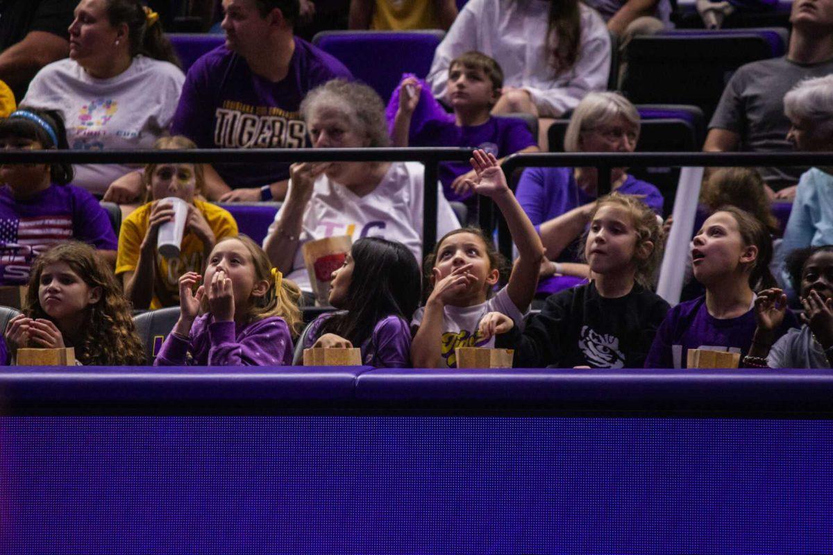 LSU gymnastics fans watch as a routine is performed on the jumbotron Monday, Dec. 12, 2022, during the annual "Gym 101" showcase in the Pete Maravich Assembly Center.