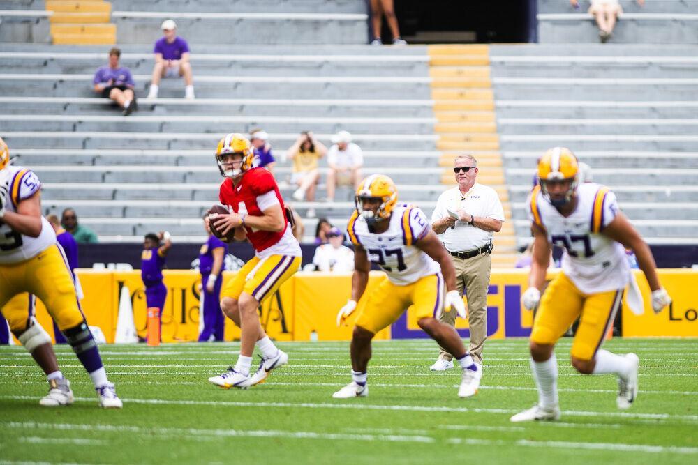 LSU football head coach Brian Kelly takes notes on the play Saturday, April 23, 2022, during LSU football&#8217;s annual spring football game with White winning 51-31 over Purple in Tiger Stadium.