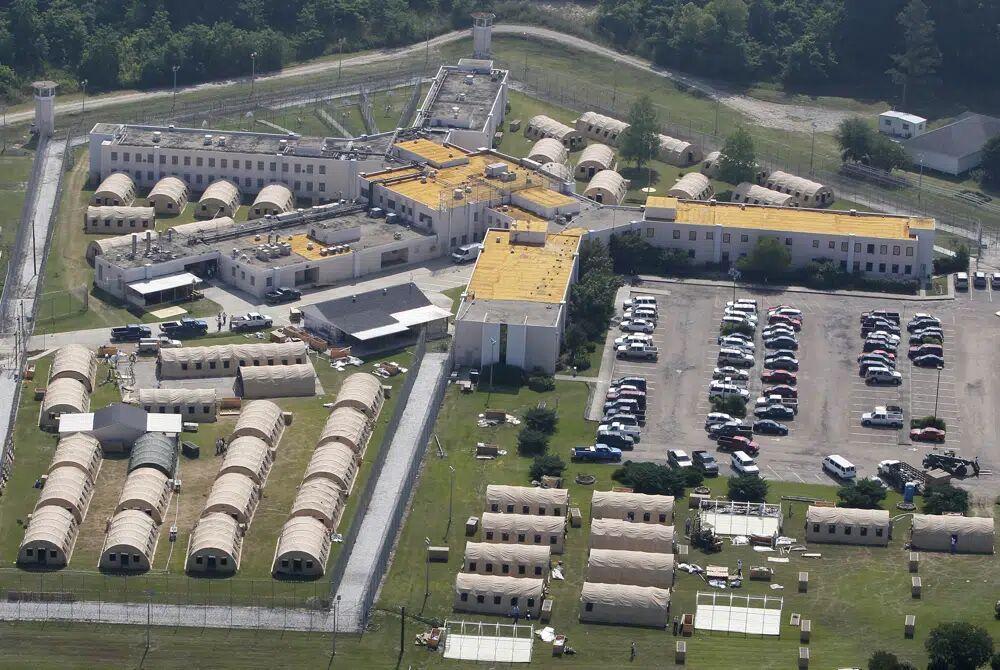 FILE - The Louisiana State Penitentiary at Angola is seen in West Feliciana Parish, La., May 9, 2011. Louisiana's prison system routinely holds people beyond their legal release dates, the U.S. Department of Justice said Wednesday, Jan. 25, 2023, in a report concluding that the state has failed for years to develop solutions to &#8220;systemic overdetentions&#8221; that violate inmates' rights and are financially costly to taxpayers.&#160;