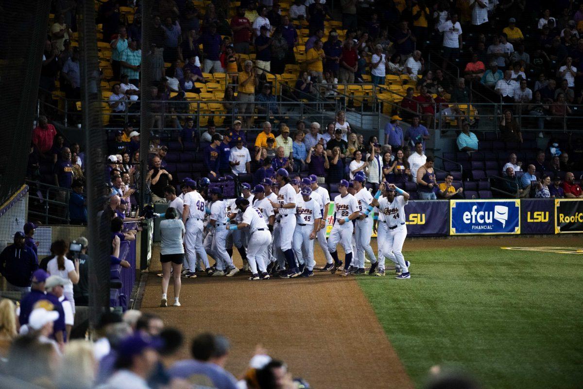 LSU baseball celebrates after sophomore infielder Jacob Berry (14) hitting a home run Monday, May, 3, 2022, during the Tigers&#8217; 10-6 win against Nicholls at Alex Box Stadium in Baton Rouge, La.