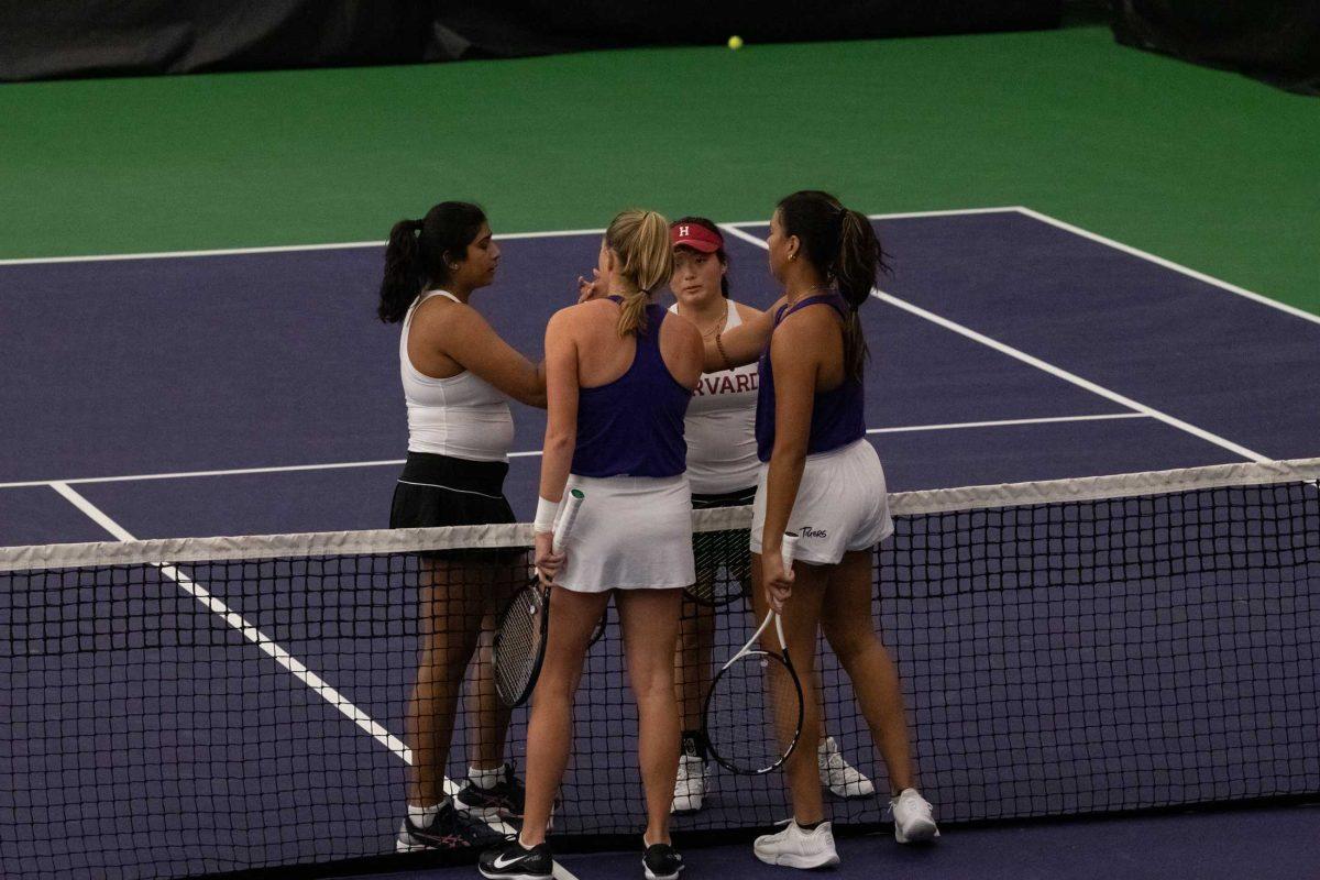 LSU women&#8217;s tennis seniors Maggie Cubitt and Safiya Carrington bump fists with their Harvard opponents Friday, Jan. 27, 2023, after their 6-2 doubles win at the LSU Tennis Complex on Gourrier Avenue in Baton Rouge, La