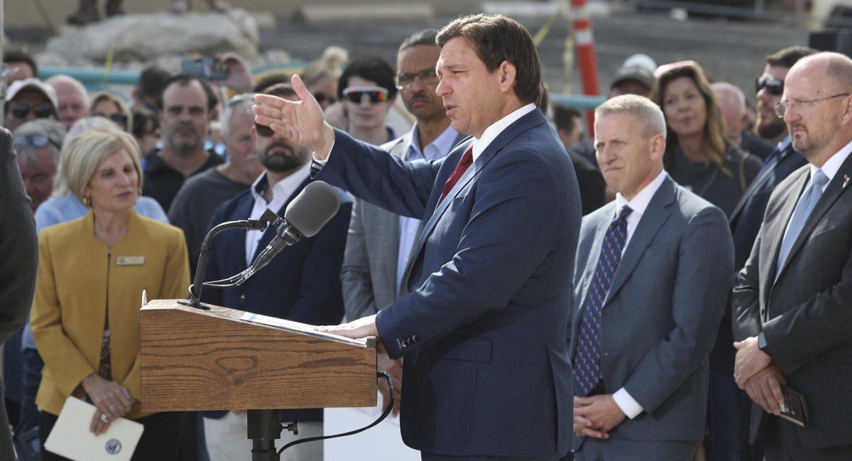 Florida Gov. Ron DeSantis speaks to the crowd gathered on the beach ramp, Wednesday Jan. 18, 2023 during a presser where he presented Volusia County officials with a multi million dollar check for beach erosion projects. (David Tucker/The Daytona Beach News-Journal via AP)