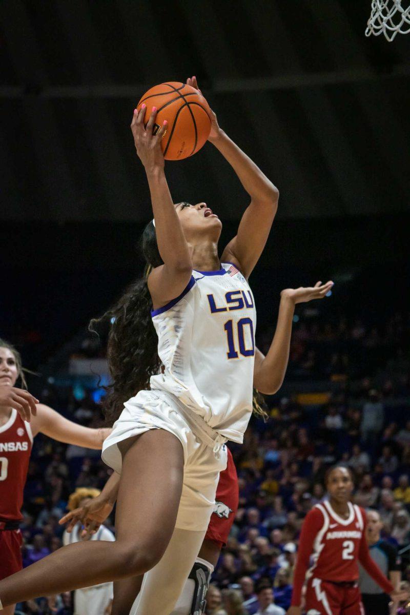 LSU women's basketball sophomore forward Angel Reese (10) makes a layup on Thursday, Jan. 19, 2023, during LSU's 79-76 win against Arkansas in the Pete Maravich Assembly Center on N. Stadium Drive in Baton Rouge, La.