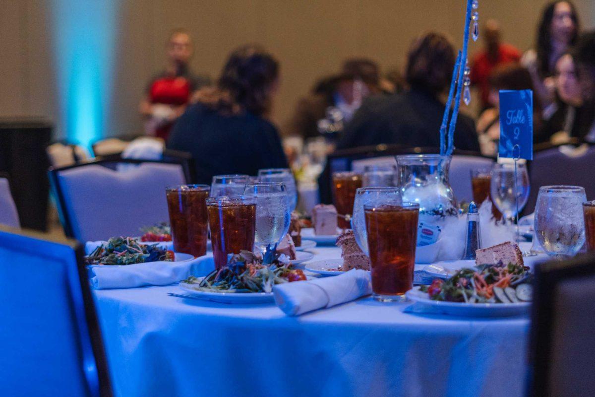 Dinner and drinks fill the table on Saturday, Jan. 21, 2023, at the Dance Marathon Gala inside the Marriot hotel on Hilton Avenue in Baton Rouge, La.