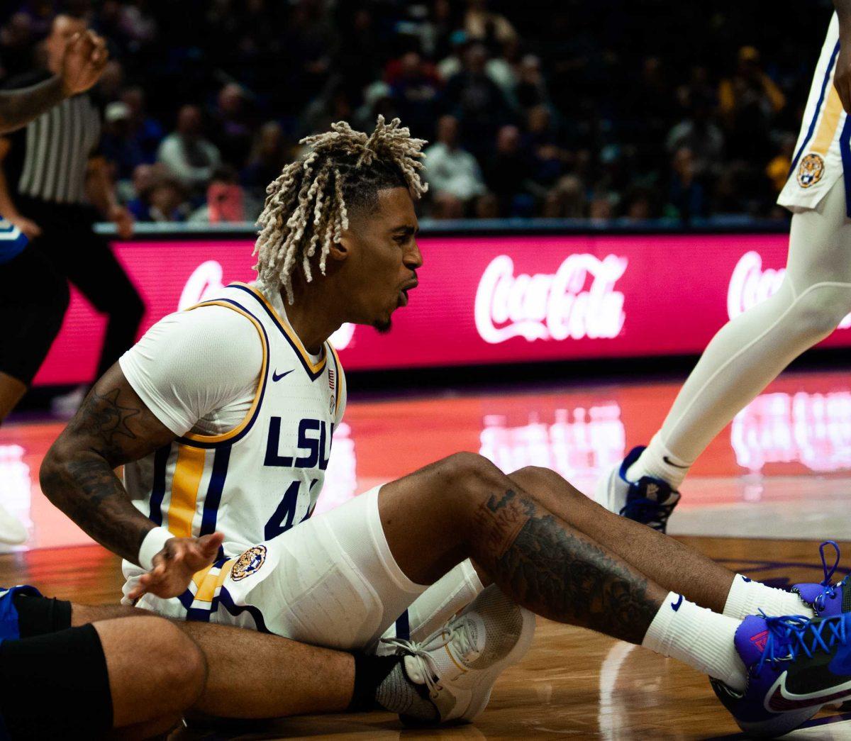 LSU men&#8217;s basketball sophomore guard Adam Miller (44) falls to the ground during LSU&#8217;s 91-62 win over New Orleans on Thursday, Nov. 17, 2022, in the Pete Maravich Assembly Center on N. Stadium Drive in Baton Rouge, La.