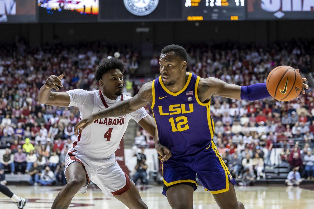 LSU forward KJ Williams (12) works against Alabama forward Noah Gurley (4) during the first half of an NCAA college basketball game, Saturday, Jan. 14, 2023, in Tuscaloosa, Ala. (AP Photo/Vasha Hunt)