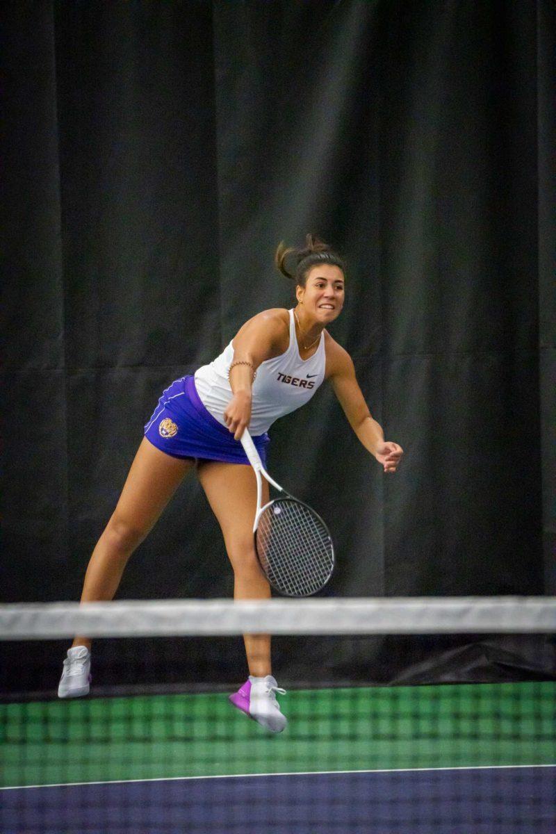 LSU women's senior Safiya Carrington hits a serve during her 6-2, 6-3 singles win on Sunday, Jan. 29, 2023, against Penn State at the LSU Tennis Complex on Gourrier Avenue in Baton Rouge, La.