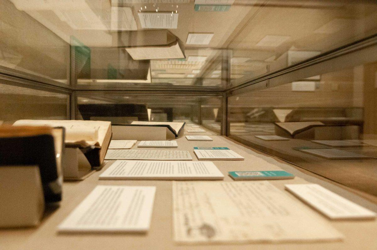 Historical books, important letters and QR codes are strategically placed in a glass case at the Water and Louisiana Consequences with Coastal Land exhibit at Hill Memorial Library on Field House Drive in Baton Rouge, La on Tuesday, Oct. 11, 2022.