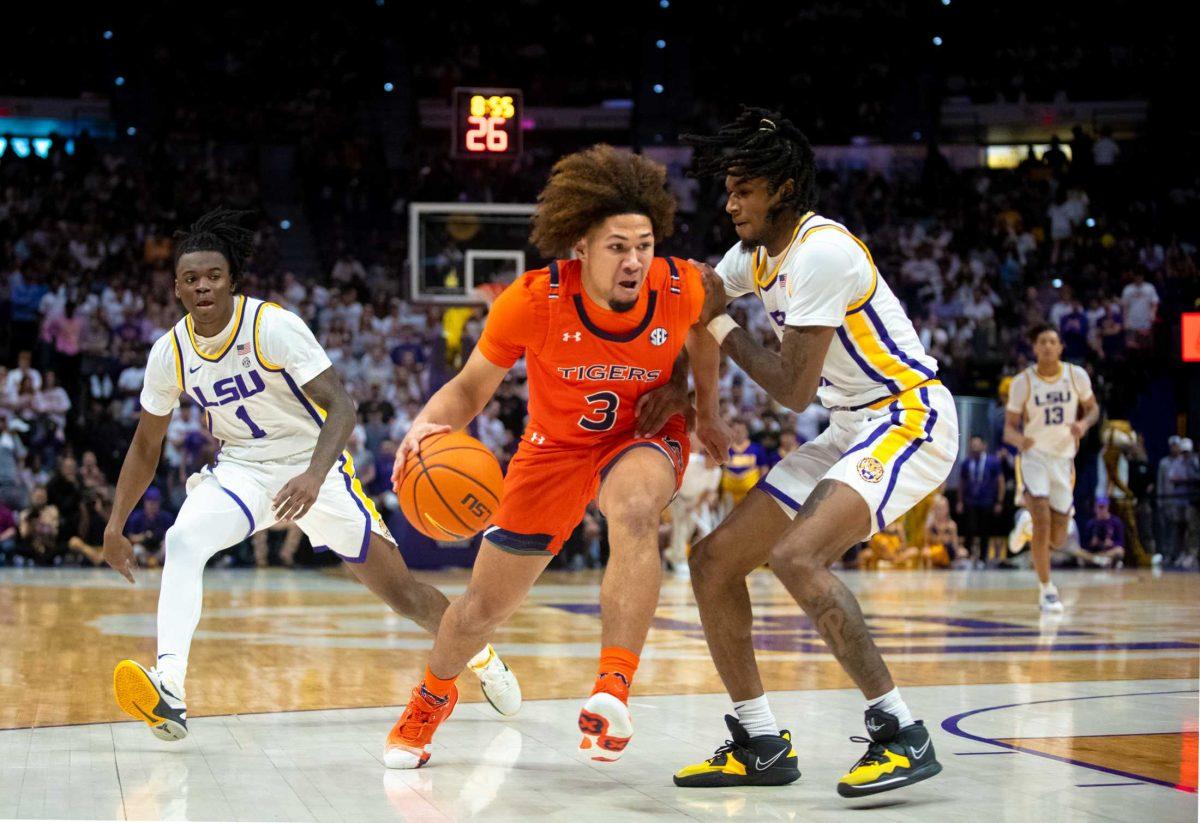 LSU men&#8217;s basketball junior guard Cam Hayes (1) and sophomore guard Justice Williams (11) guard their opponent on Wednesday, Jan. 18, 2023, during LSU&#8217;s 49-67 loss against Auburn in the Pete Maravich Assembly Center in Baton Rouge, La.