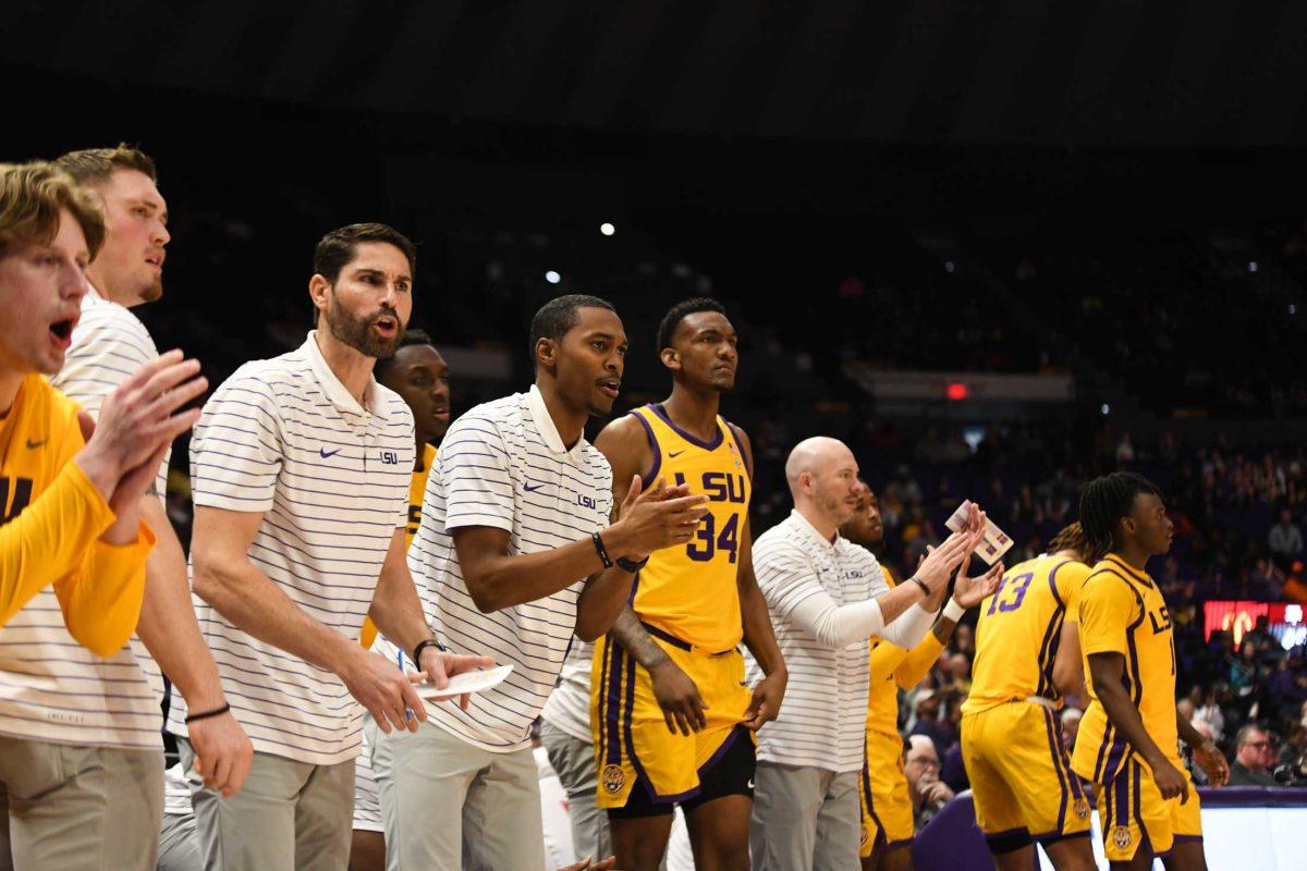 The LSU men&#8217;s basketball team and coaches yell from the side on Saturday, Feb. 11, 2023, during LSU&#8217;s 74-62 loss to Texas A&amp;M at the Pete Maravich Assembly Center in Baton Rouge, La.