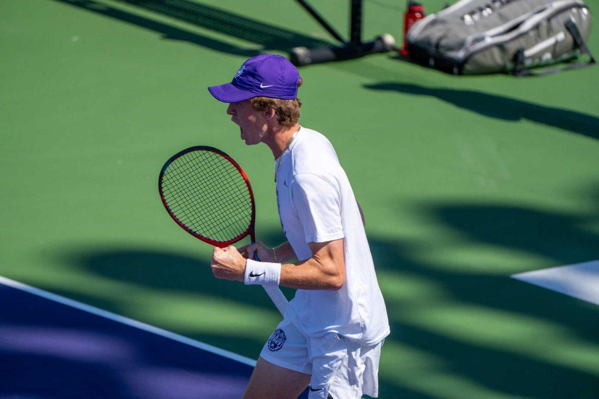 LSU men's tennis junior Welsh Hotard celebrates a point during his 6-4 doubles win against ULL Sunday, Feb. 26, 2023, at the LSU tennis complex on Gourrier Avenue in Baton Rouge, La.