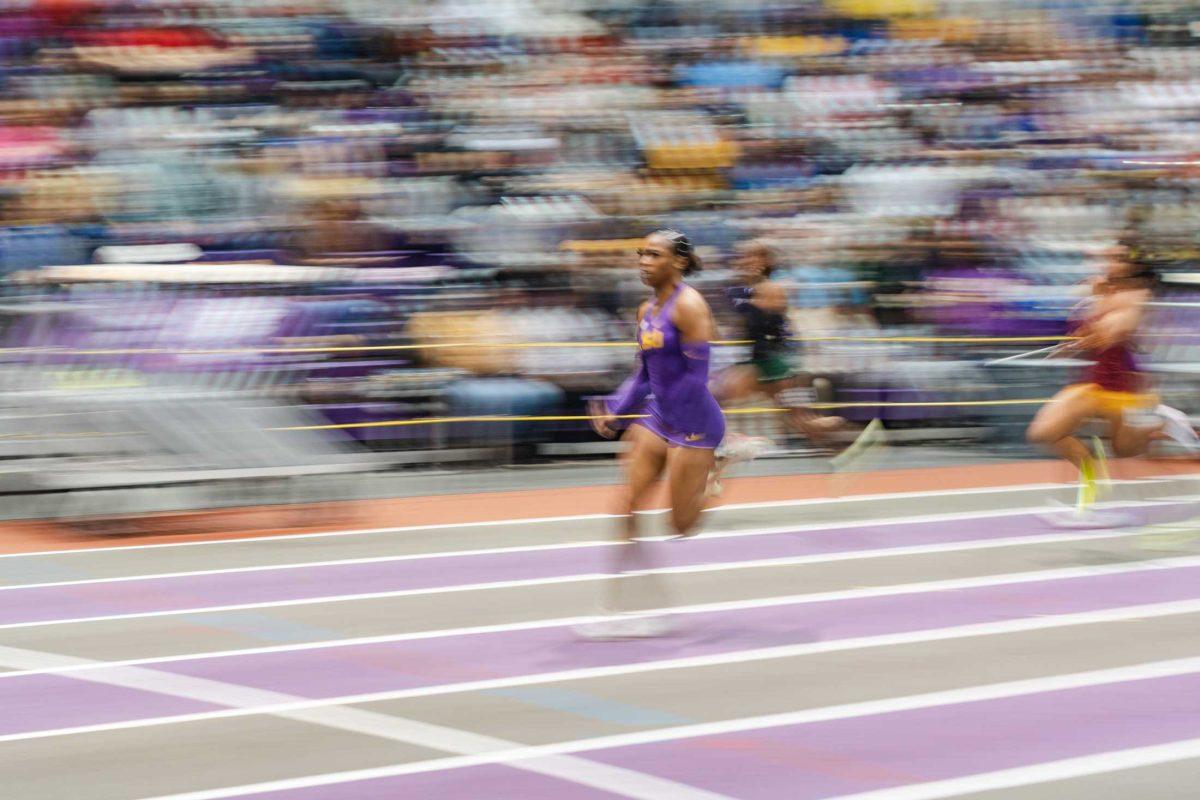 LSU track and field junior sprinter Alia Armstrong zooms down the track on Friday, Jan. 13, 2023, during the LSU Purple Tiger meet at the Carl Maddox Field House in Baton Rouge, La.