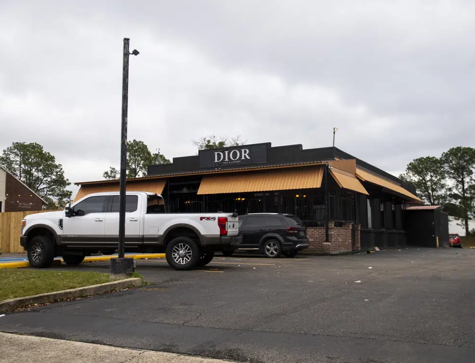 FILE - Dior Bar &amp; Lounge on Bennington Avenue was the scene of an overnight shooting that left multiple people injured, Jan. 22, 2023, in Baton Rouge, La. On Friday, Feb. 10, police in Louisiana's capital city of Baton Rouge arrested two people for a mass shooting that left 12 others wounded at a nightclub in January.&#160;