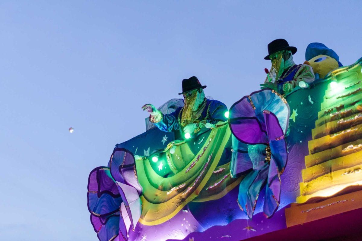 Krewe members toss various items on Saturday, Feb. 18, 2023, as part of the Endymion parade in New Orleans, La.