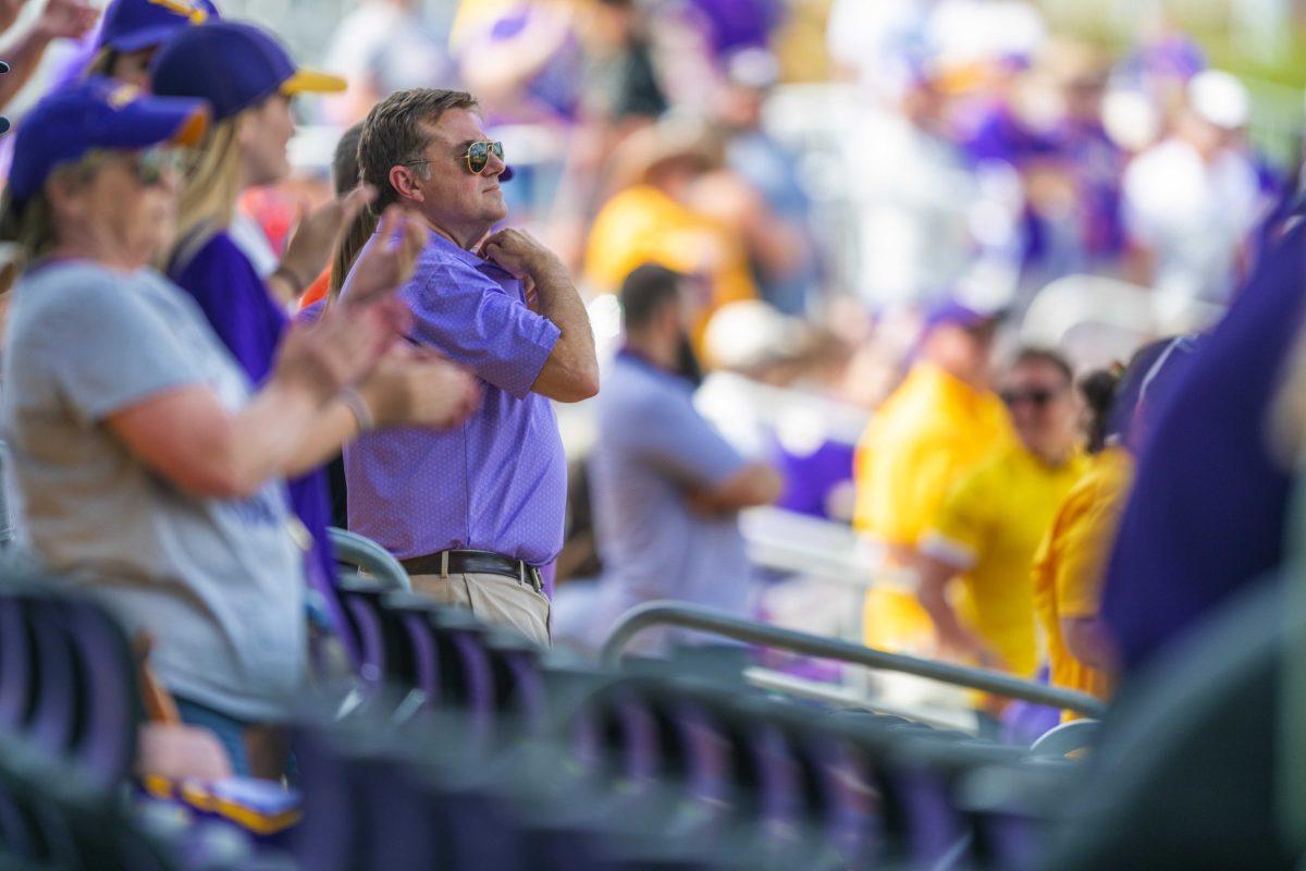 An LSU baseball fan waits anxiously for the game to end Saturday, April 23, 2022, during LSU's 8-6 win over Missouri at Alex Box Stadium.