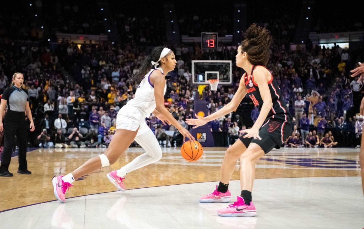 LSU women&#8217;s basketball sophomore forward Angel Reese (10) avoids her opponent on Thursday, Feb. 2, 2023, during LSU&#8217;s 82-77 victory against UGA in the Pete Maravich Assembly Center in Baton Rouge, La.