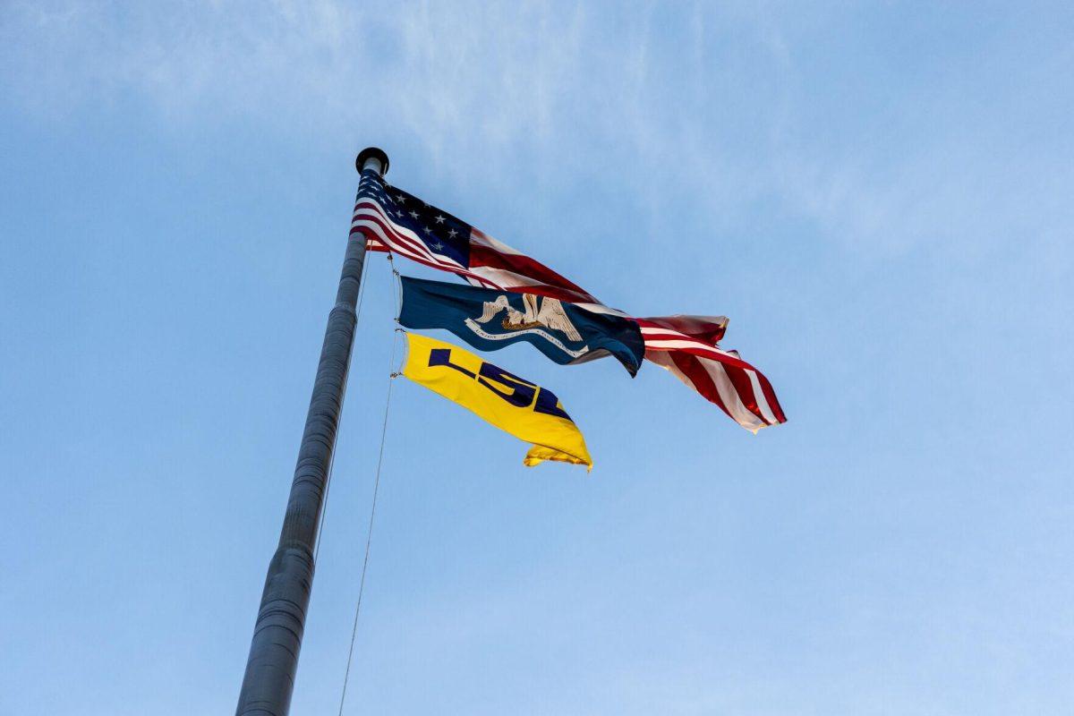 A United States, Louisiana and LSU flag flutters in the breeze Monday, Feb. 6, 2023 on the Parade Grounds.