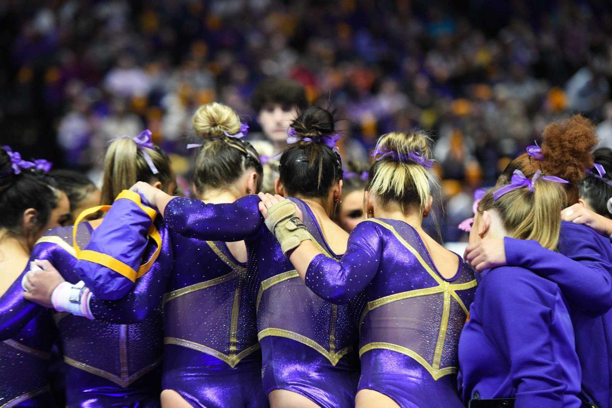 The LSU gymnastics team huddles together Friday, Feb. 3, 2023, during LSU's 197.700 - 196.925 victory over Georgia in the Pete Maravich Assembly Center in Baton Rouge, La.