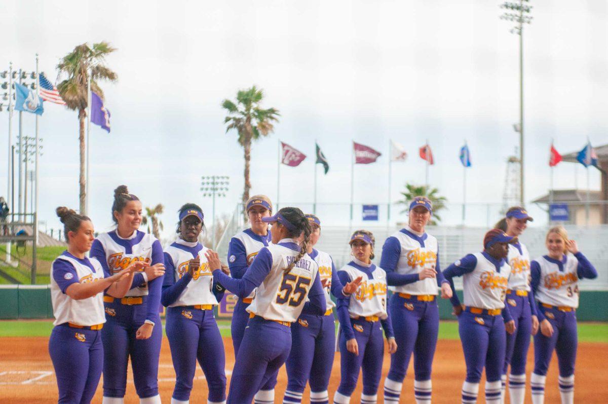 LSU softball junior utility Raeleen Gutierrez (55) greets her team members on the non-starting lineup Friday, Feb. 17, 2023, during LSU's 8-0 win against Ohio at Tiger Park in Baton Rouge, La.