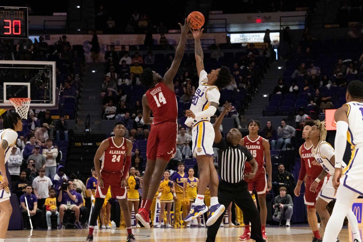 LSU men&#8217;s basketball junior forward Derek Fountain (20) and Alabama&#8217;s sophomore center Charles Bediako (14) tip-off Saturday, Feb. 4, 2023, at the start of LSU&#8217;s 79-69 loss to Alabama at the Pete Maravich Assembly Center in Baton Rouge, La.