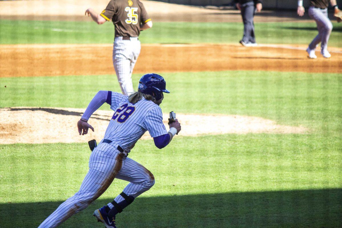 LSU baseball freshman outfielder Paxton Kling (28) sprints to home base Saturday, Feb. 18, 2023, during LSU's 5-3 victory over Western Michigan at Alex Box Stadium on LSU's campus.