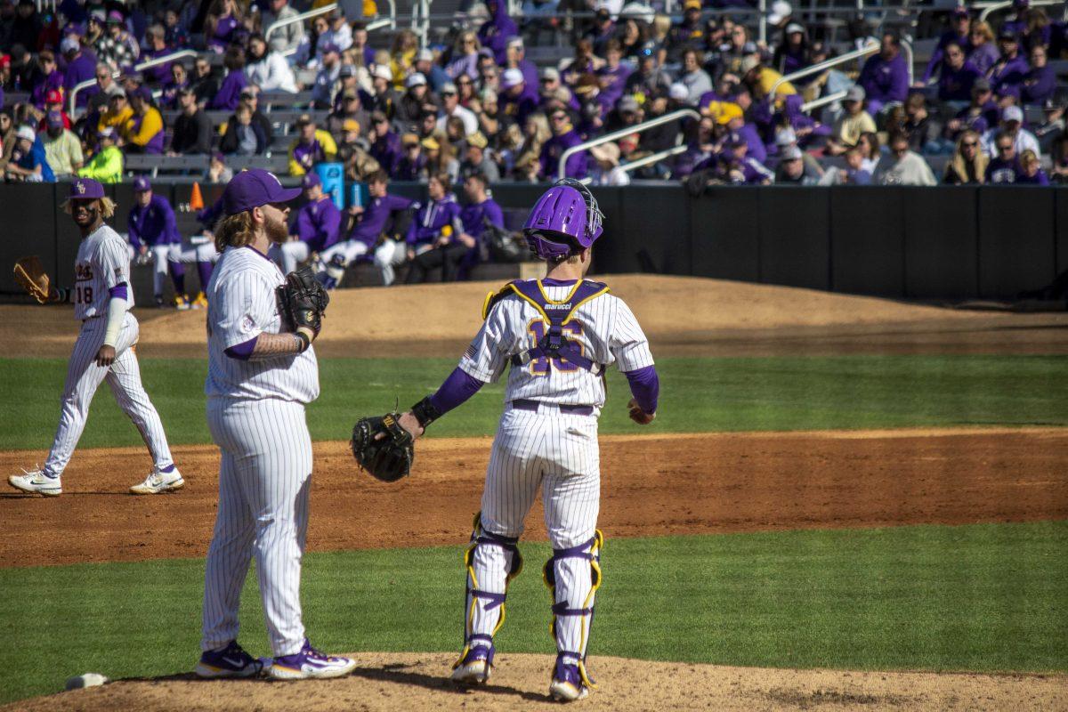 LSU baseball junior left-handed pitcher Riley Cooper (38) speaks with freshman catcher Brady Neal (16) Saturday, Feb. 18, 2023, during LSU's 5-3 victory over Western Michigan at Alex Box Stadium on LSU's campus.