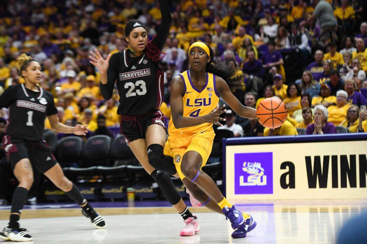 LSU women&#8217;s basketball freshman guard Flau&#8217;jae Johnson (4) dribbles the ball on Sunday, Feb. 26, 2023, during LSU&#8217;s 74-59 win over Mississippi State at the Pete Maravich Assembly Center in Baton Rouge, La.