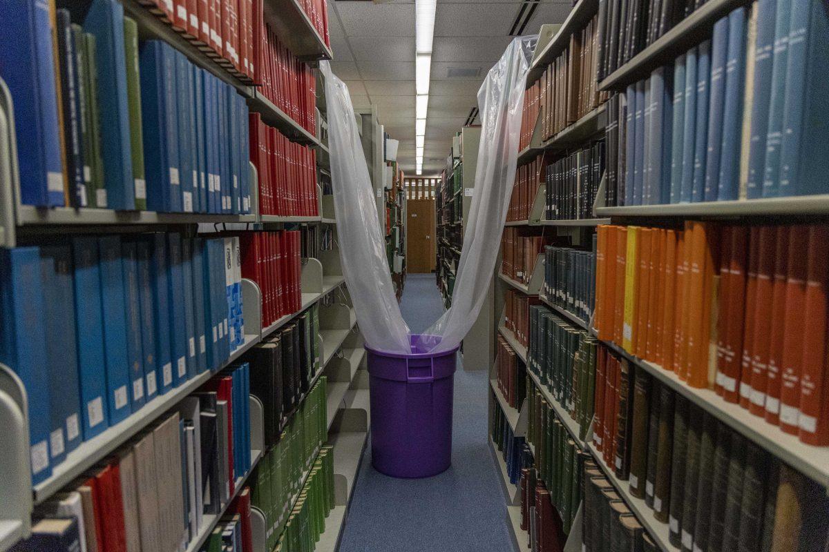 Plastic sheets cover bookselves Thursday, Feb. 2, 2023, in the LSU Library.