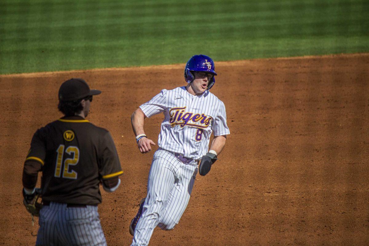 LSU baseball graduate student infield/ outfield Gavin Dugas (8) runs through second base Saturday, Feb. 18, 2023, during LSU's 5-3 victory over Western Michigan at Alex Box Stadium on LSU's campus.