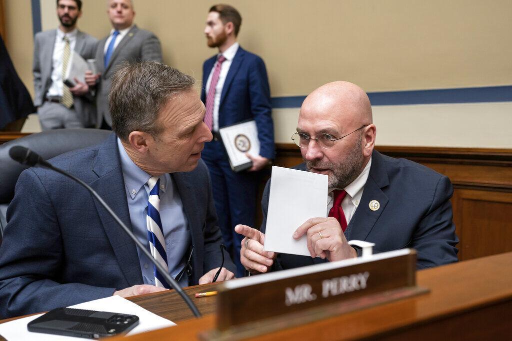 House Committee on Oversight and Accountability members Rep. Scott Perry, R-Pa., left, confers with Rep. Clay Higgins, R-La., during an organizational meeting for the 118th Congress, at the Capitol in Washington, Tuesday, Jan. 31, 2023. (AP Photo/J. Scott Applewhite)