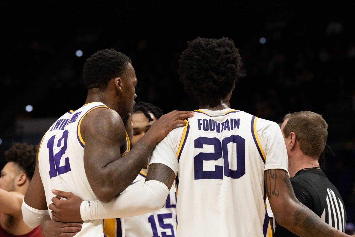 LSU men&#8217;s basketball fifth-year senior forward KJ Williams (12) and junior forward Derek Fountain (20) briefly pause together Saturday, Feb. 4, 2023, while the referees make a decision during LSU&#8217;s 79-69 loss to Alabama at the Pete Maravich Assembly Center in Baton Rouge, La.